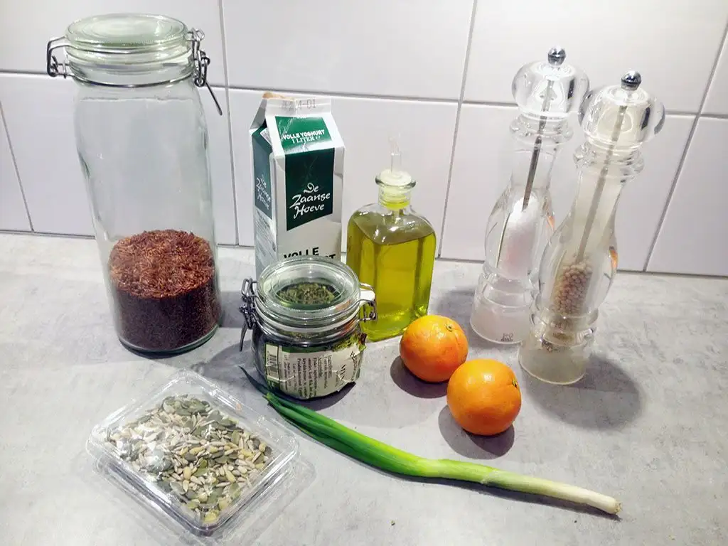 Red rice and orange salad ingredients