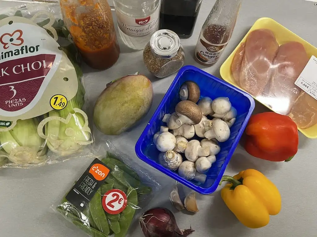 Sweet and sour chicken with bok choy and mango ingredients