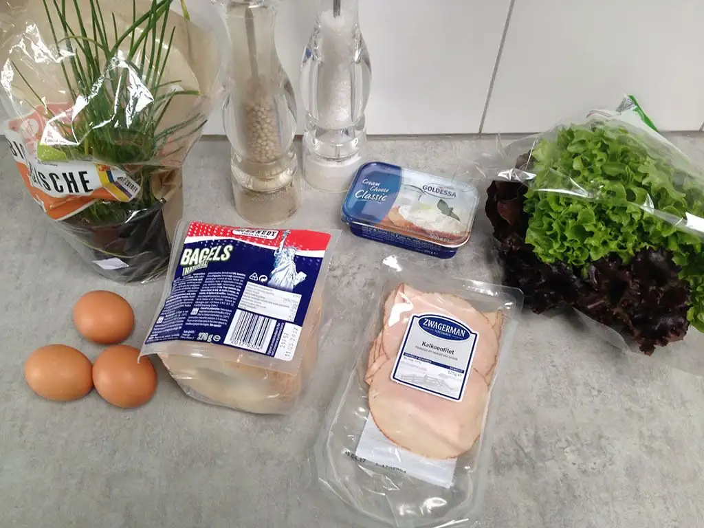 Bagel with cream cheese, egg and smoked turkey ingredients