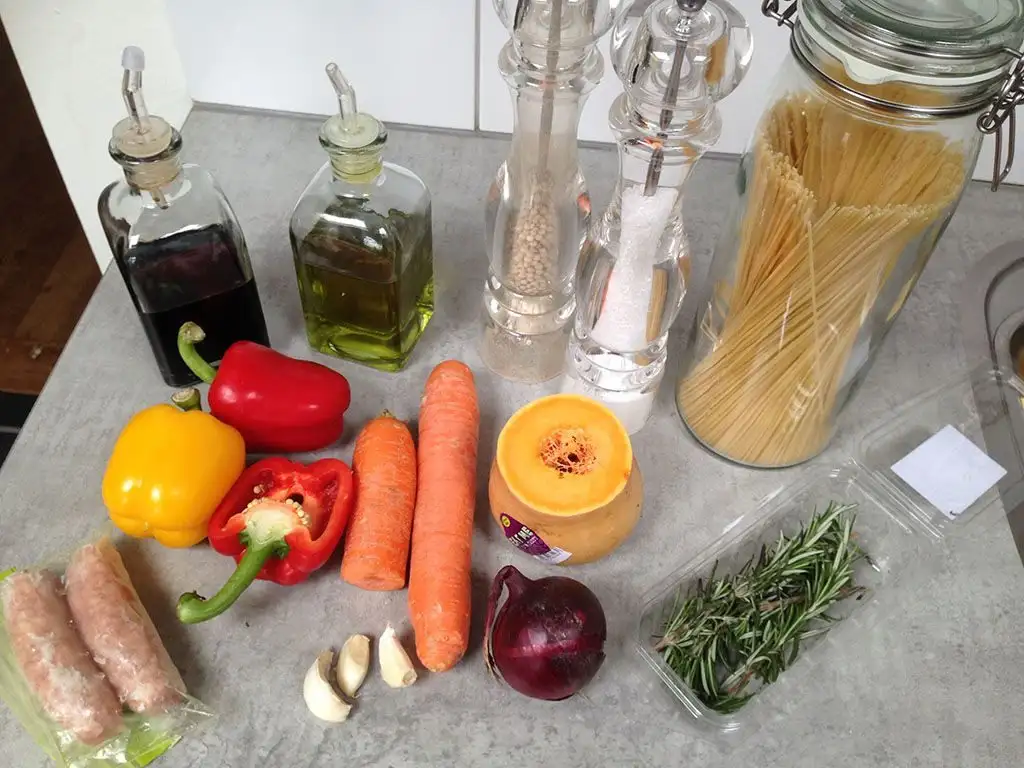 Pasta with oven-baked vegetables and sausage ingredients