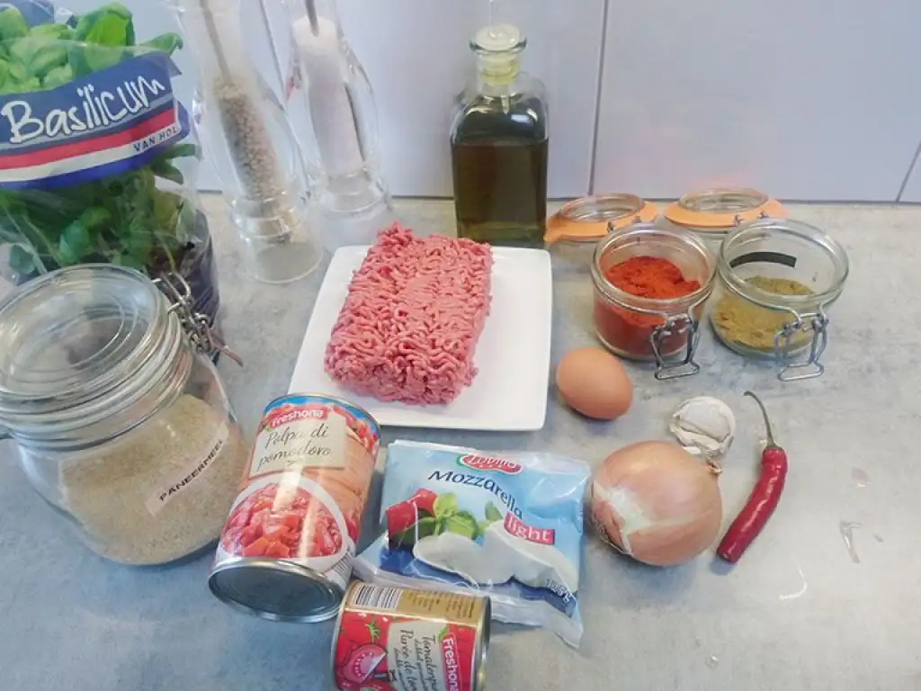 Oven baked meatballs in tomato sauce and mozzarella ingredients