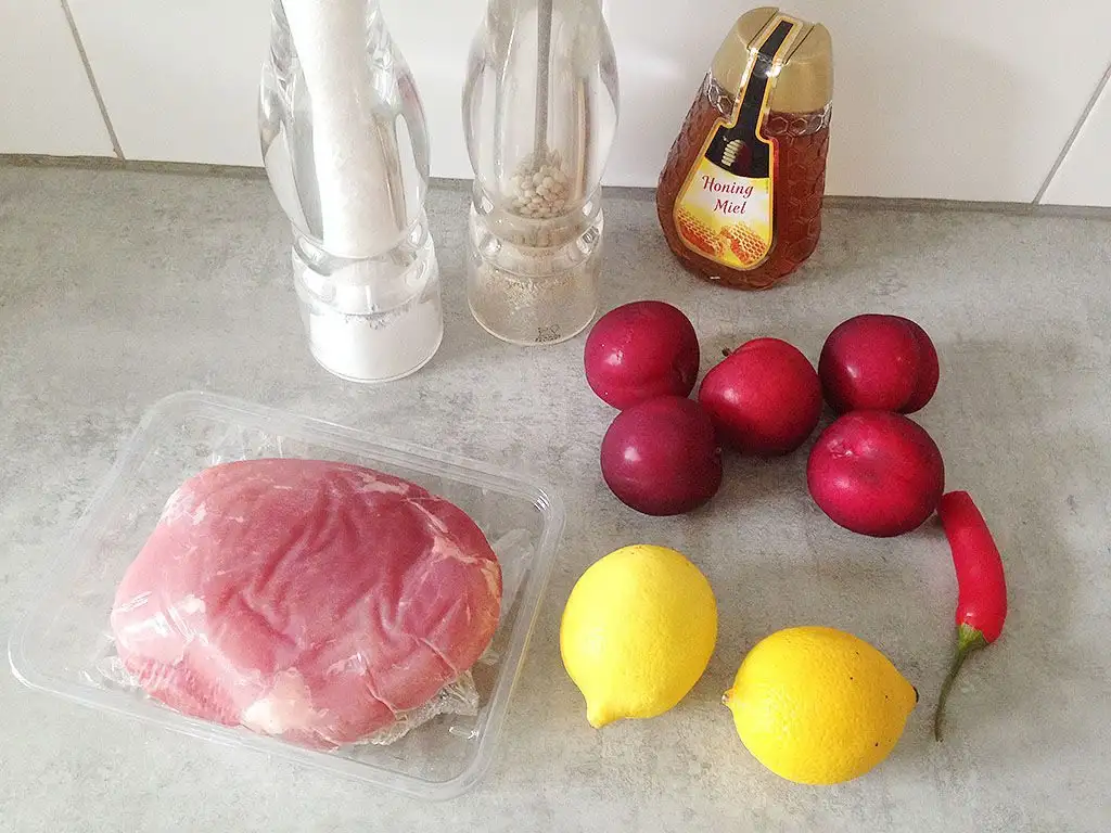 Slow-cooked ham with plums and lemon ingredients