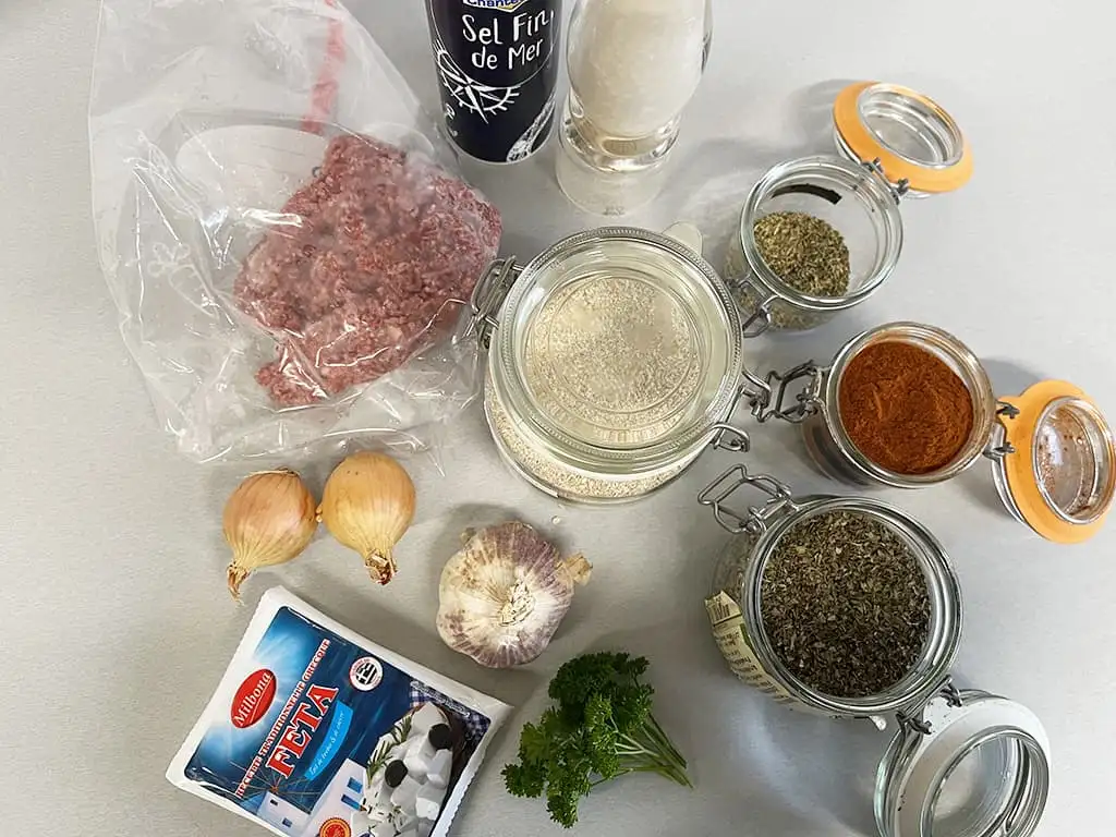 Bifteki (Greek burgers) with feta ingredients