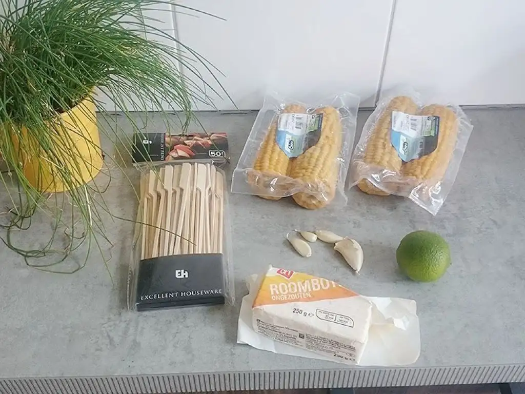 Barbecued corn on the cob with garlic butter ingredients