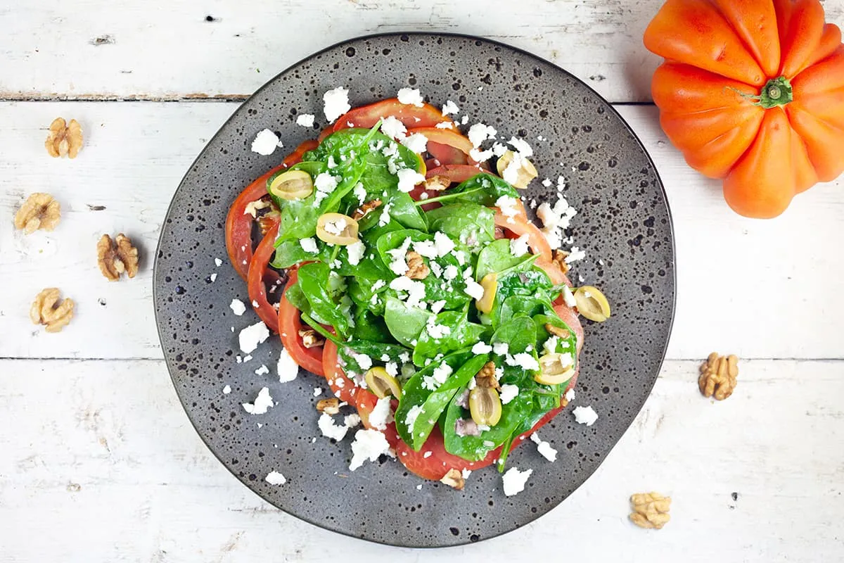 Tomato spinach salad (and crumbled feta)