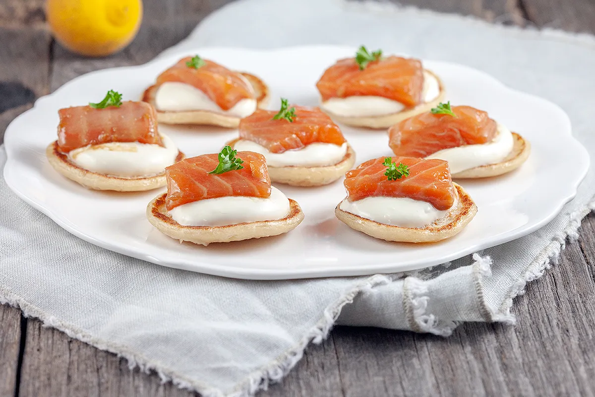 Salmon and yuzu blinis
