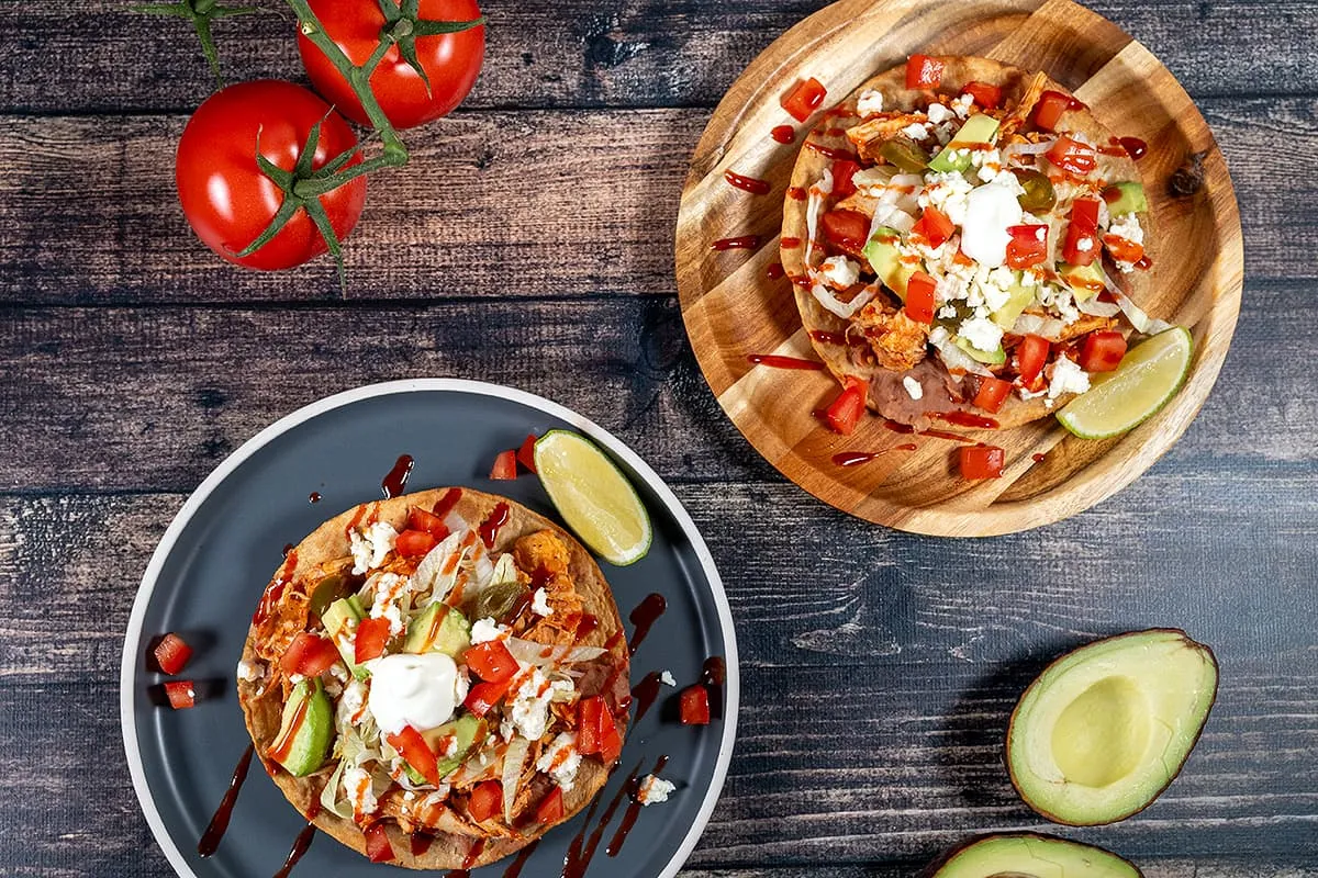 Chicken tostadas with beans - fried Mexican tortillas