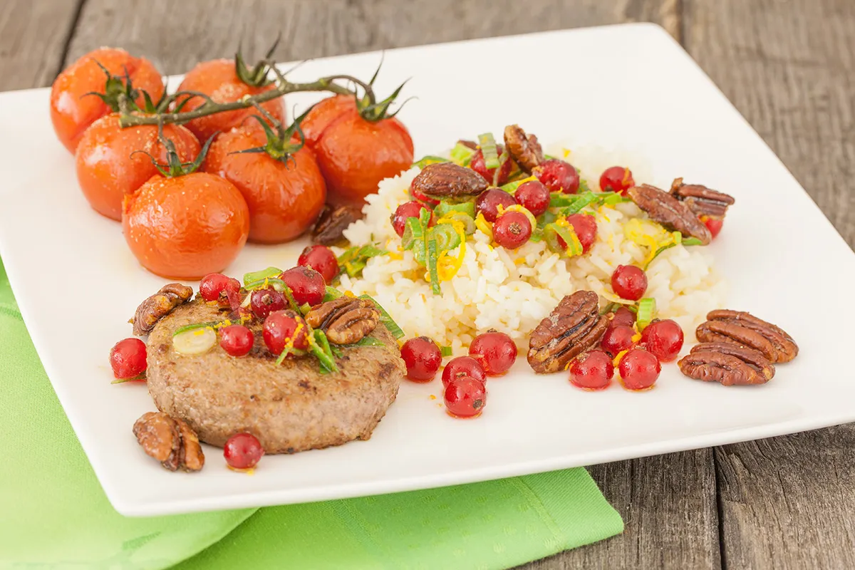 Caramelised pecan rice with oven baked tomatoes