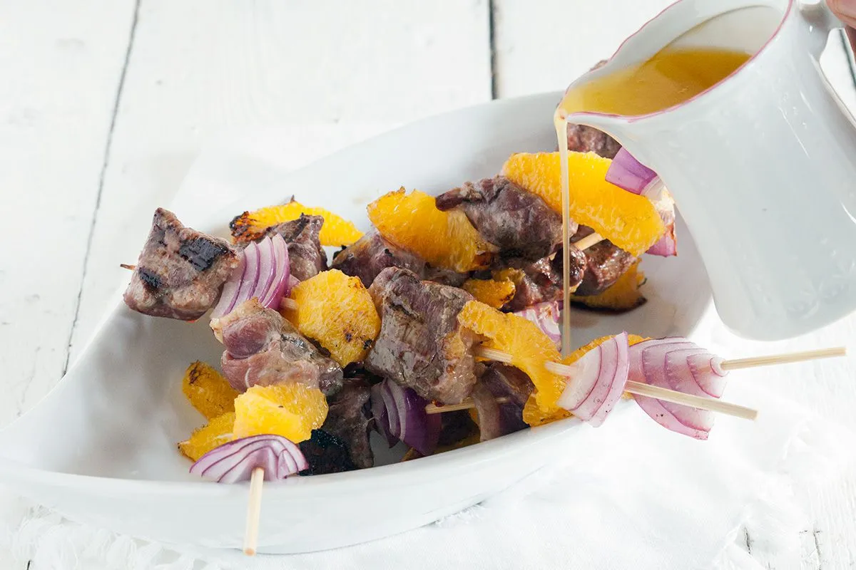Duck kebabs with orange butter sauce