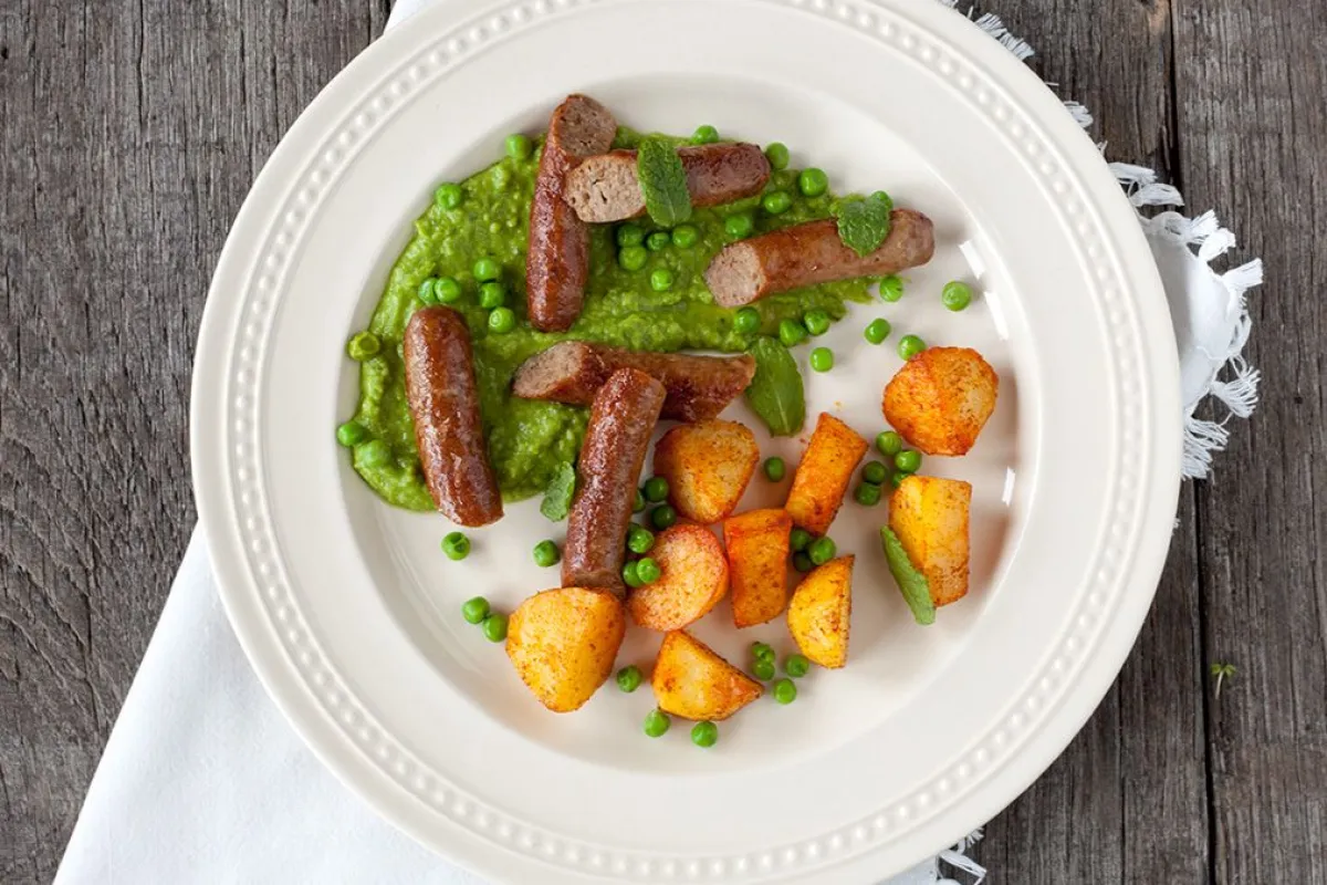 Lamb sausages with minted pea puree