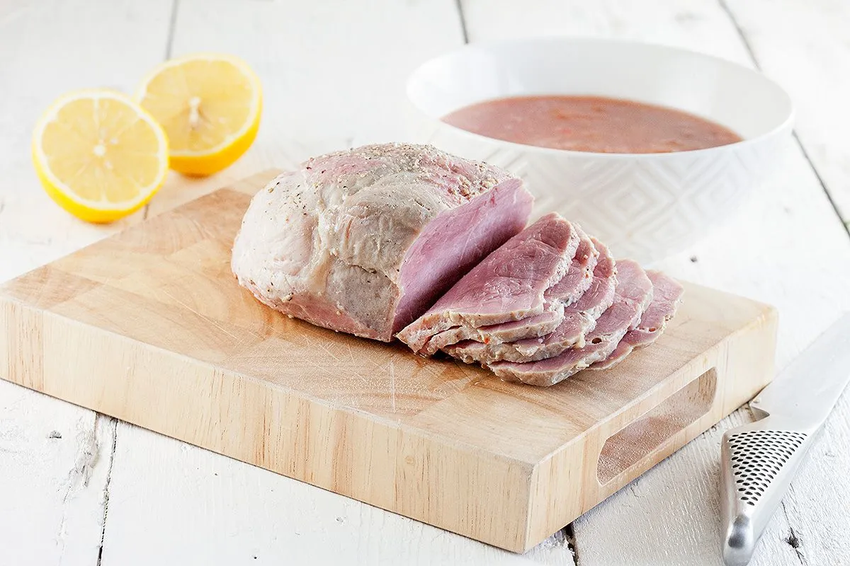 Slow-cooked ham with plums and lemon