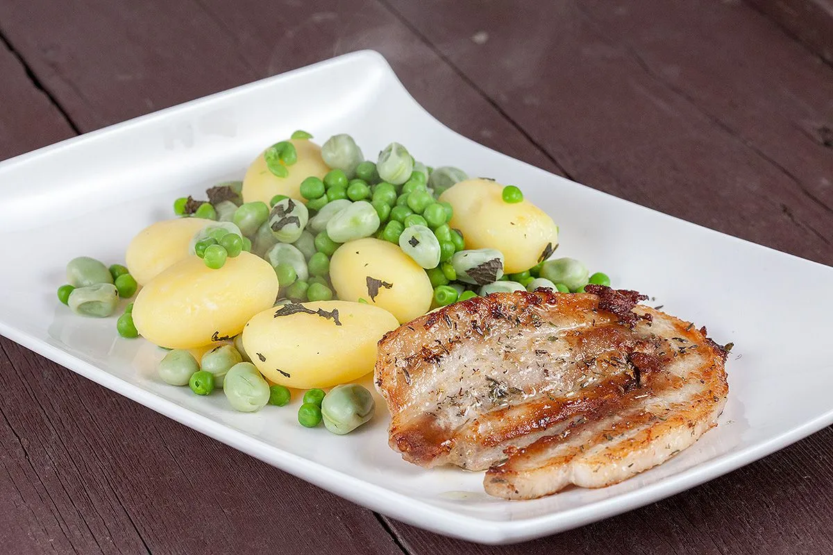 Pork belly slices and broad bean potato salad
