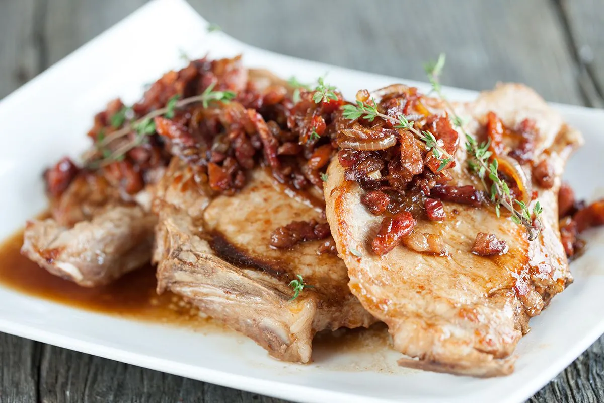 Pork chops with bacon and caramelised onions