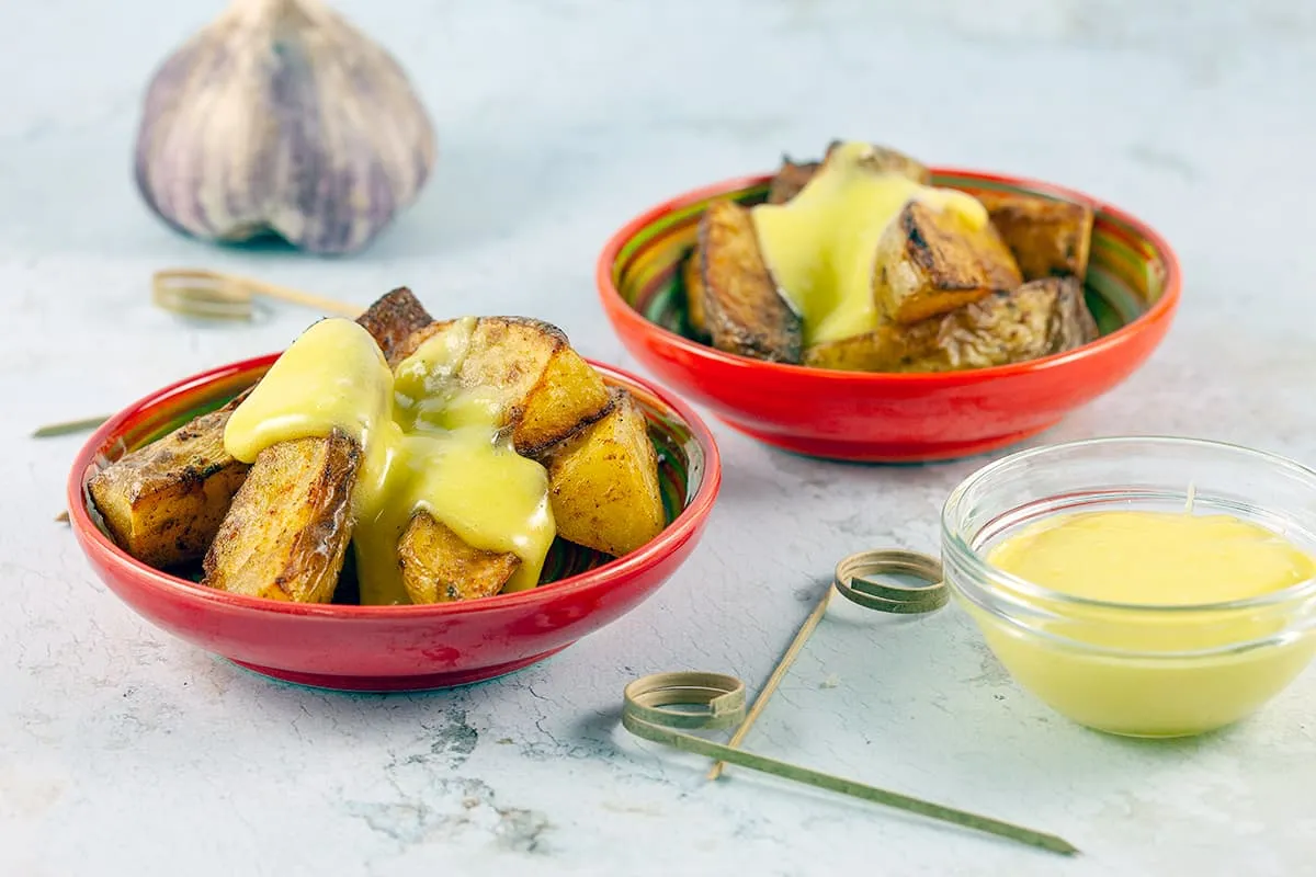 Patatas bravas with aioli (Spanish potatoes)