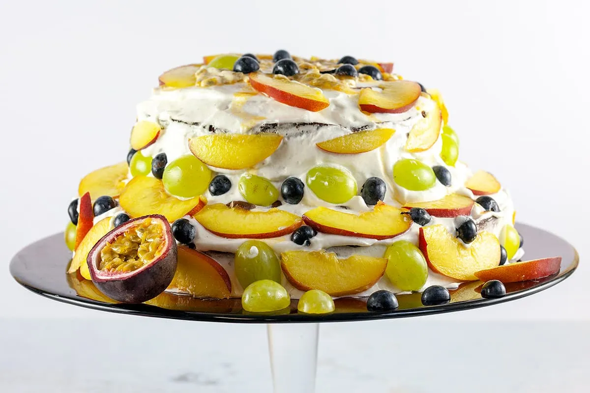 Fruit cake with whipped cream (birthday cake)