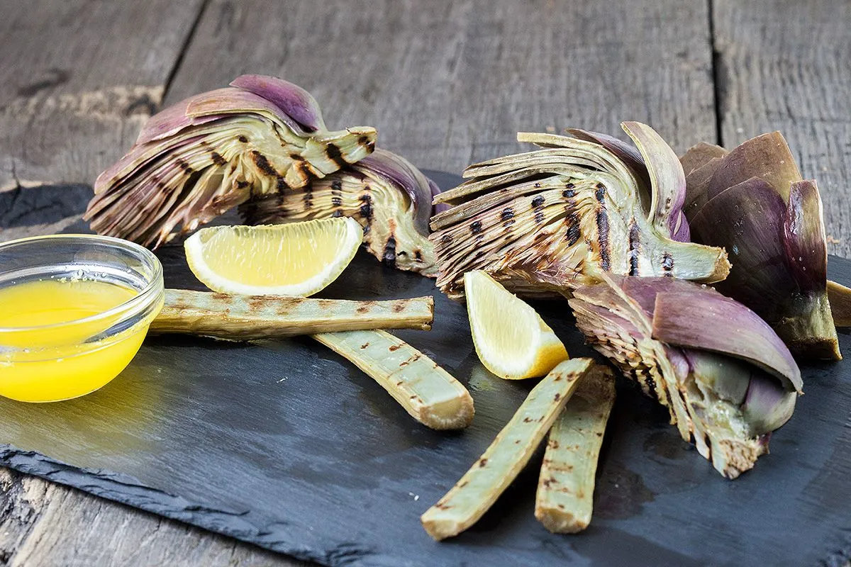 Grilled artichokes and stems with lemon butter sauce