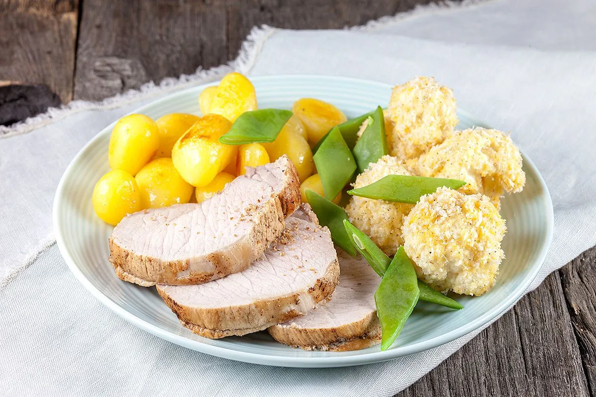 Pork roulade with baked cauliflower and baby potatoes