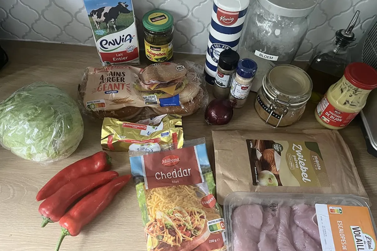 Turkey burgers with cheese sauce and grilled peppers