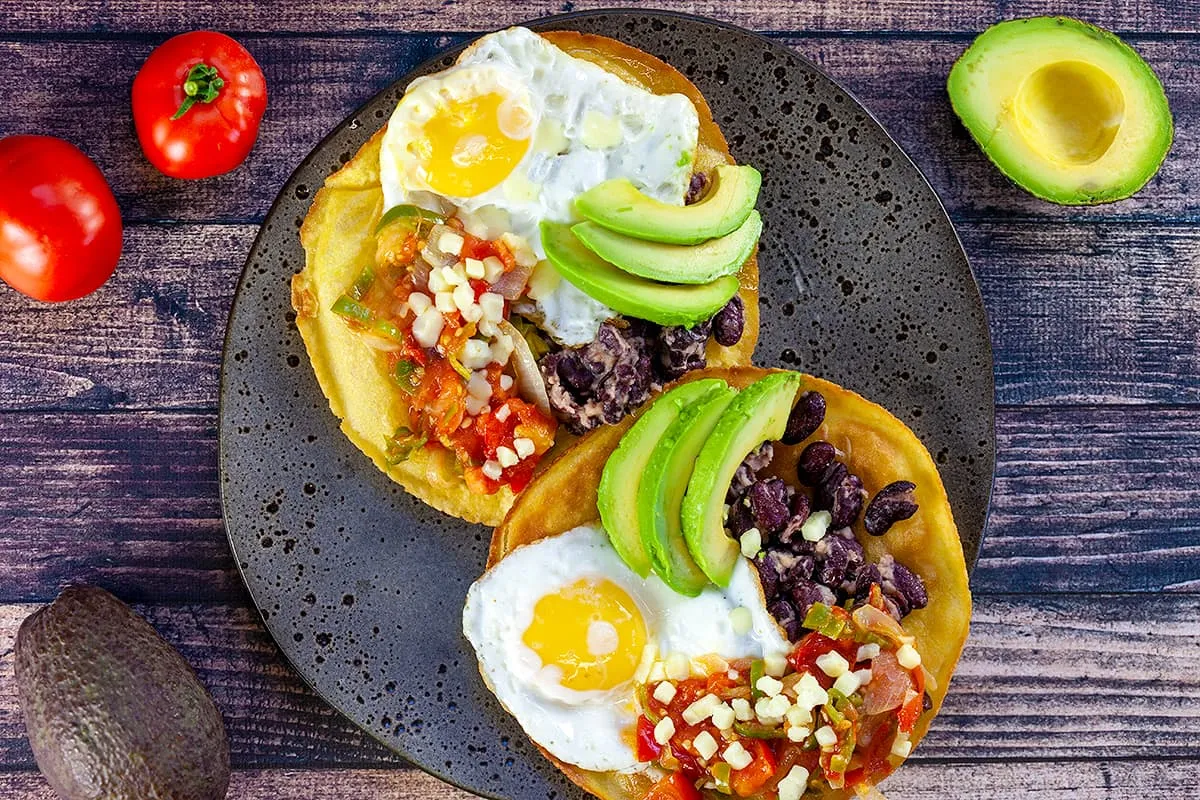 Huevos rancheros (Mexican breakfast with eggs and beans)