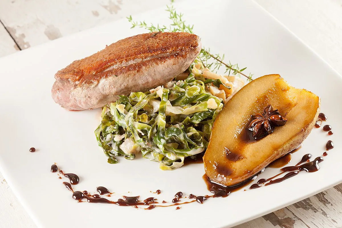 Pan-fried duck breast with creamed cabbage