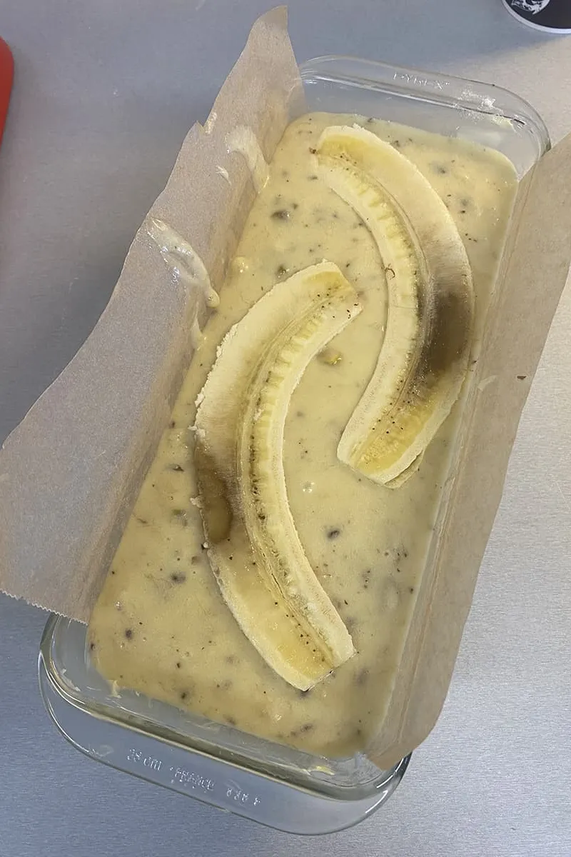 Halved bananas on top of the banana bread