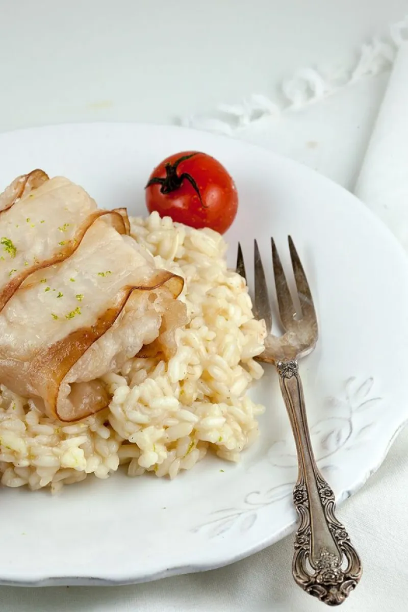 Bacon-wrapped cod with lime risotto