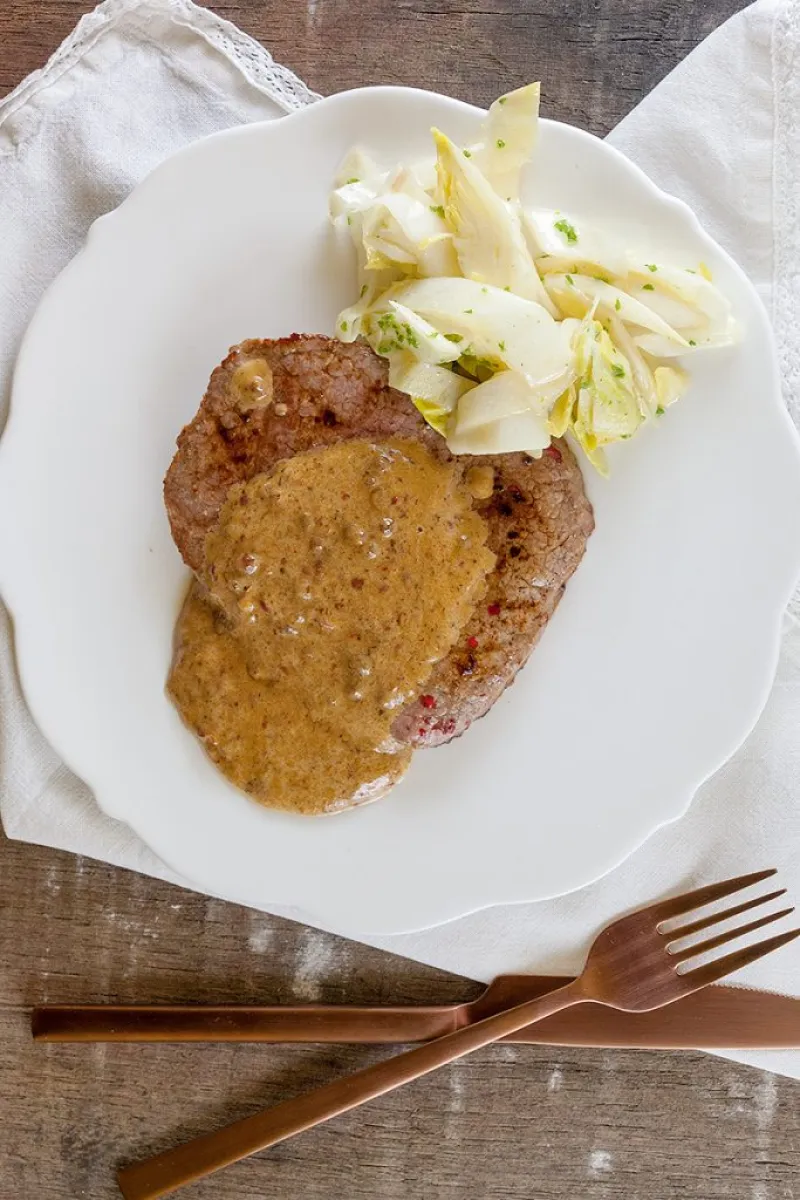Steak with pink peppercorn sauce