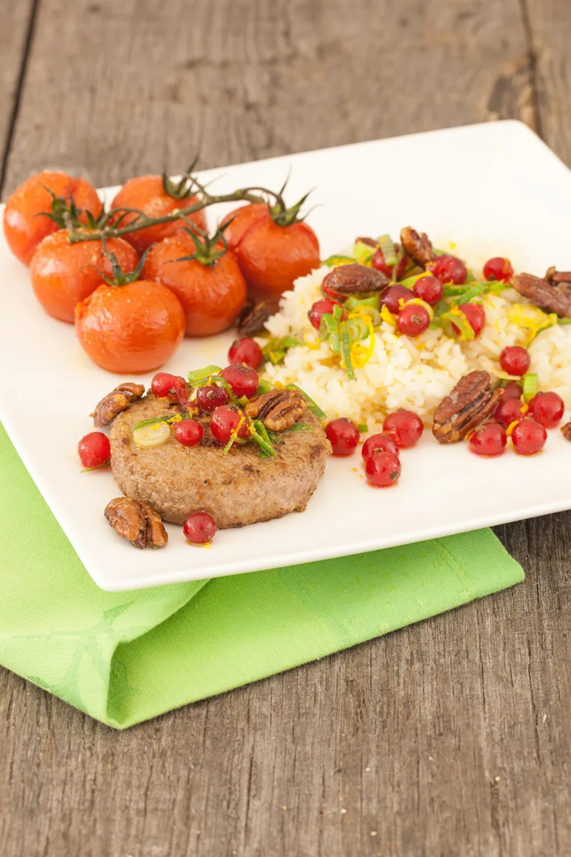 Caramelised pecan rice with oven baked tomatoes